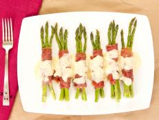 Cooking Channel serves up this Asparagus Wrapped in Prosciutto with Beurre Blanc recipe from Kelsey Nixon plus many other recipes at CookingChannelTV.com