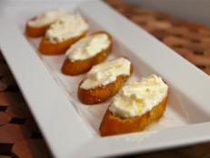 Cooking Channel serves up this Three Cheese Crostini with Honey recipe from Kelsey Nixon plus many other recipes at CookingChannelTV.com