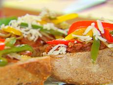 Cooking Channel serves up this Meatball Heros with Tri-Colored Peppers recipe from Ellie Krieger plus many other recipes at CookingChannelTV.com