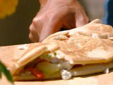 Cooking Channel serves up this Hummus Piadine with Cucumber and Feta Salad recipe from Michael Chiarello plus many other recipes at CookingChannelTV.com