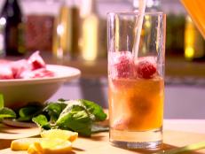 Cooking Channel serves up this Lemon-Ginger Iced Tea with Berry Cubes recipe from Ellie Krieger plus many other recipes at CookingChannelTV.com