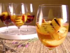 Cooking Channel serves up this Grilled Peaches in Wine recipe from Giada De Laurentiis plus many other recipes at CookingChannelTV.com