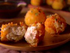 Cooking Channel serves up this Smoked Mozzarella and Ricotta Fritters recipe  plus many other recipes at CookingChannelTV.com