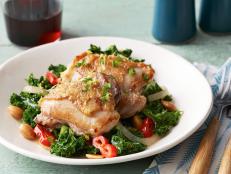 Cooking Channel serves up this Chicken Thighs with Kale recipe from Michael Symon plus many other recipes at CookingChannelTV.com