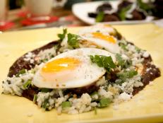 Cooking Channel serves up this Poached Eggs in Mole with Creamy Green Rice recipe from Bobby Flay plus many other recipes at CookingChannelTV.com