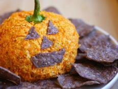 Cooking Channel serves up this Nacho Jack-o'-Lantern Cheese Ball recipe  plus many other recipes at CookingChannelTV.com