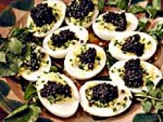 Cooking Channel serves up this Eggs with Caviar recipe from Michael Symon plus many other recipes at CookingChannelTV.com
