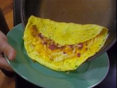 Cooking Channel serves up this Omelet for a Crowd recipe from Alton Brown plus many other recipes at CookingChannelTV.com