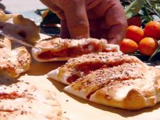 Cooking Channel serves up this Strawberry Rhubarb Calzone recipe from Michael Chiarello plus many other recipes at CookingChannelTV.com