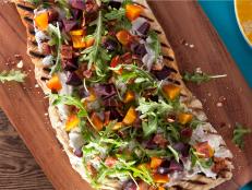 Cooking Channel serves up this Beet, Bacon and Herbed Goat Cheese Flatbread recipe from Kelsey Nixon plus many other recipes at CookingChannelTV.com
