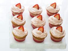 Cooking Channel serves up this Strawberry Surprise Cupcakes recipe  plus many other recipes at CookingChannelTV.com