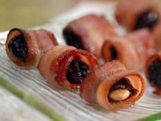 Cooking Channel serves up this Almond-Stuffed Bacon-Wrapped Prunes recipe from Laura Calder plus many other recipes at CookingChannelTV.com