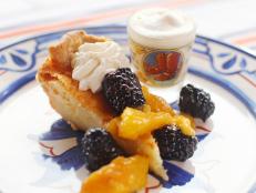 Cooking Channel serves up this Whiskey Buttermilk Pie with Fresh Whipped Cream and Tipsy Blackberries and Peaches recipe  plus many other recipes at CookingChannelTV.com