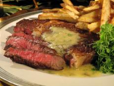 Cooking Channel serves up this Rib Eye Steak in Beurre Blanc with Duck Fat Fries recipe from Nadia G. plus many other recipes at CookingChannelTV.com