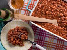 Cooking Channel serves up this Tangy Maple Baked Beans with Applewood Smoked Bacon recipe from Kelsey Nixon plus many other recipes at CookingChannelTV.com