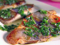 Cooking Channel serves up this Tilapia with Purple Potato Crust and Chive Rosemary Oil recipe from Giada De Laurentiis plus many other recipes at CookingChannelTV.com