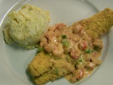 Cooking Channel serves up this Fried Catfish topped with Crawfish Au Gratin Sauce recipe  plus many other recipes at CookingChannelTV.com