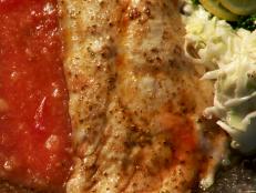 Cooking Channel serves up this Grilled Rockfish with Stewed Tomatoes and Coleslaw recipe  plus many other recipes at CookingChannelTV.com
