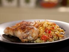 Cooking Channel serves up this Arroz Con Pollo recipe from Rachael Ray plus many other recipes at CookingChannelTV.com