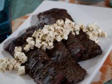 Cooking Channel serves up this Marinated Skirt Steak with Quick-Pickled Feta recipe from Alexandra Guarnaschelli plus many other recipes at CookingChannelTV.com