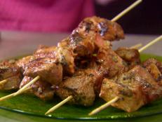 Cooking Channel serves up this Grilled Passion Fruit Pork Satays with Passion Fruit Tzatziki, Herbed Couscous and Vegetable Stir-Fry recipe from Roger Mooking plus many other recipes at CookingChannelTV.com