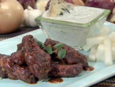 Cooking Channel serves up this Hot Wings with Blue Cheese-Yogurt Sauce recipe from Bobby Flay plus many other recipes at CookingChannelTV.com