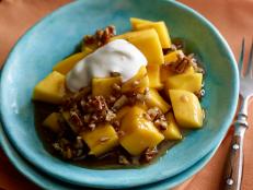 Cooking Channel serves up this Mangoes Foster with Creme Fraiche recipe from Bobby Flay plus many other recipes at CookingChannelTV.com