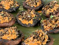 Cooking Channel serves up this Grilled Portobellos Filled with Wild Rice-Almond Pilaf and Piquillo Pepper Vinaigrette recipe from Bobby Flay plus many other recipes at CookingChannelTV.com