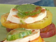 Cooking Channel serves up this Fresh Mozzarella and Stacked Heirloom Tomato Salad with Green Chile-Cilantro Oil and Chipotle Vinegar recipe from Bobby Flay plus many other recipes at CookingChannelTV.com