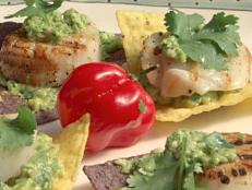 Cooking Channel serves up this Grilled Sea Scallops on Tortilla Chips with Avocado Puree and Jalapeno Pesto recipe from Bobby Flay plus many other recipes at CookingChannelTV.com