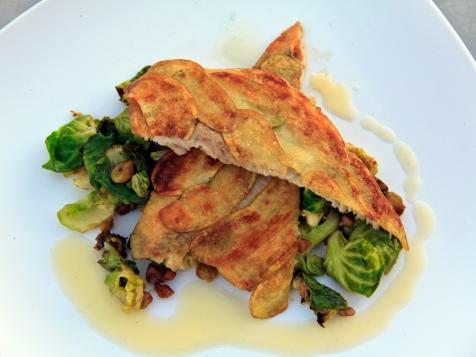 Potato-Crusted Trout Filets with Caramelized Brussels Sprouts, Plump Golden Raisins, and Toasted Pecans