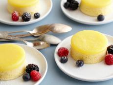 Cooking Channel serves up this Lemon Pudding Cake with Fresh Mixed Berries recipe from Tyler Florence plus many other recipes at CookingChannelTV.com