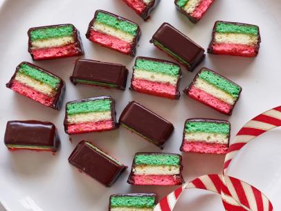 RAINBOW COOKIES
Debi Mazar and Gabriele Corcos
Cooking Channel
Unsalted Butter, Almond Paste, Sugar, Orange Zest, Vanilla Bean, Eggs, Allpurpose
Flour, Fine
Salt, Red Food Coloring, Green Food Coloring, Cherry Jelly or Preserves, Apricot Jam,
Semisweet Chocolate, Honey, Heavy Cream