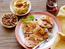 Cooking Channel serves up this Silver Dollar Buttermilk-Pecan Pancakes with Bourbon Molasses Butter and Maple Syrup recipe from Bobby Flay plus many other recipes at CookingChannelTV.com