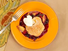 Cooking Channel serves this Skillet Blueberry-Peach Cobbler recipe from Kelsey Nixon plus many other recipes at CookingChannelTV.com