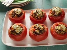 Cooking Channel serves up this Stuffed Tomatoes recipe from Alton Brown plus many other recipes at CookingChannelTV.com