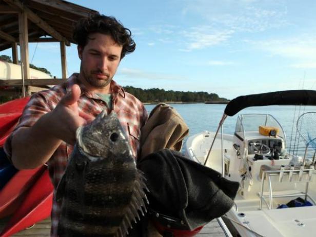 Ben Sargent hooks a sheepshead fish.