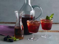 Cooking Channel serves up this Blackberry-Bourbon Iced Tea recipe from Bobby Flay plus many other recipes at CookingChannelTV.com