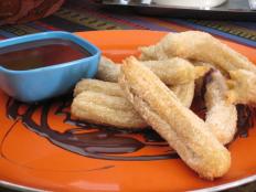 Cooking Channel serves up this Churros with Spiced Sugar and Chocolate Dipping Sauce recipe from Bobby Flay plus many other recipes at CookingChannelTV.com