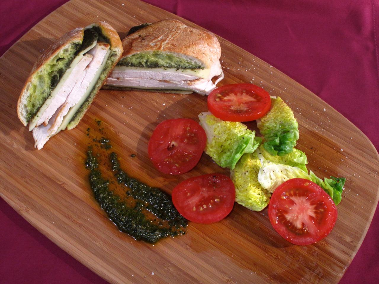 https://cook.fnr.sndimg.com/content/dam/images/cook/fullset/2010/11/5/0/CCEFF108_Pressed-Roast-Turkey-Pesto-and-Provolone-Sandwich_s4x3.jpg.rend.hgtvcom.1280.960.suffix/1357777223692.jpeg