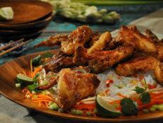 Cooking Channel serves up this Peanut Butter Chicken Wings, Rice Noodle Salad with Peanut Crunch and Rice Wine Vinegar Dressing recipe from Roger Mooking plus many other recipes at CookingChannelTV.com