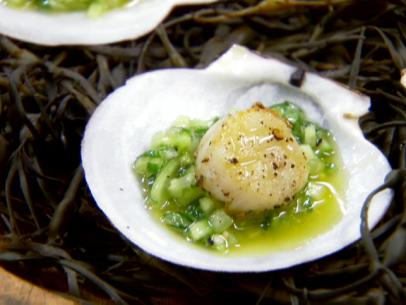 Pan grilled scallops on green gazpacho in a shell.