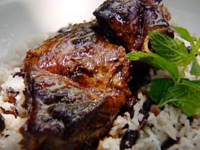 Levi's homecoming lamb is served on top of a bed of rice and peas with a garnish of mint.