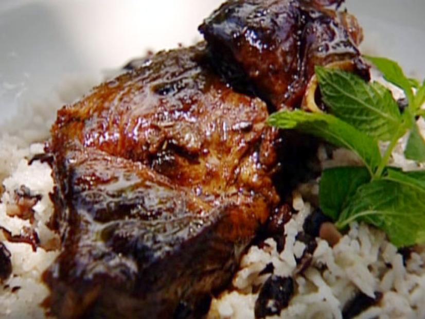 Levi's homecoming lamb is served on top of a bed of rice and peas with a garnish of mint.