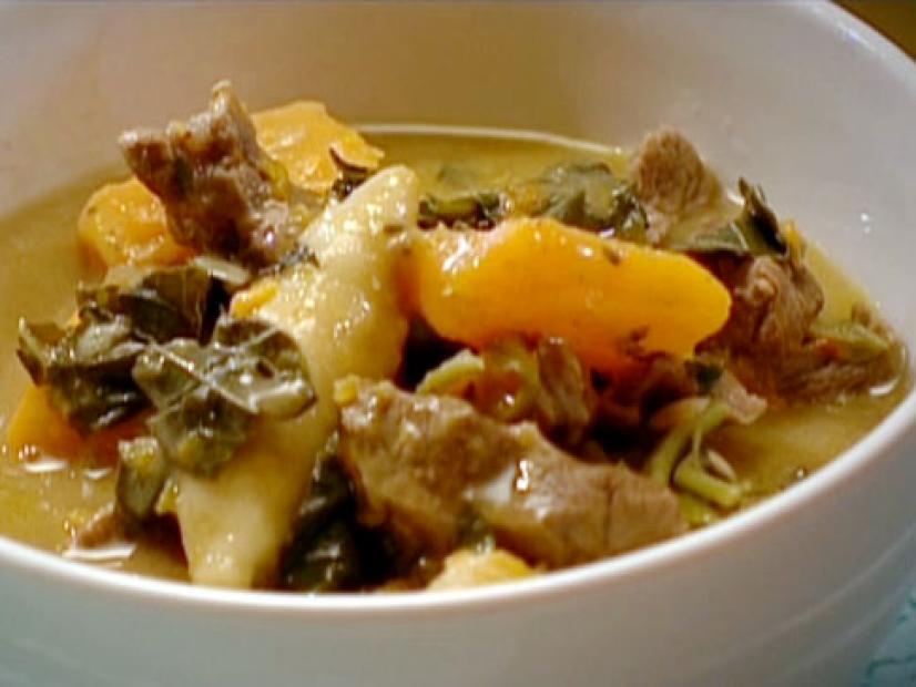 Beef pepperpot stew with spillers dumplings is made with yams, sweet potatoes, onions, beef stock, butternut squash, spinach, and several spices.