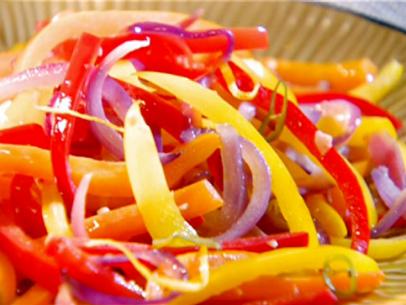 Sauteed peppers of yellow, purple, and red.
