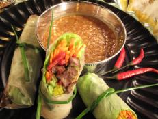 Cooking Channel serves up this Thai-Italian Spring Rolls with Peanut Dipping Sauce recipe from Nadia G. plus many other recipes at CookingChannelTV.com