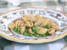 Cooking Channel serves up this Conchiglie with Guanciale and Peas recipe from Debi Mazar and Gabriele Corcos plus many other recipes at CookingChannelTV.com