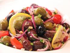Cooking Channel serves up this Marinated Olive and Tomato Salad recipe from Kelsey Nixon plus many other recipes at CookingChannelTV.com