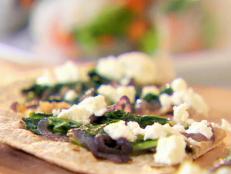 Cooking Channel serves up this Arugula, Caramelized Onion and Goat Cheese Pizza recipe from Ellie Krieger plus many other recipes at CookingChannelTV.com